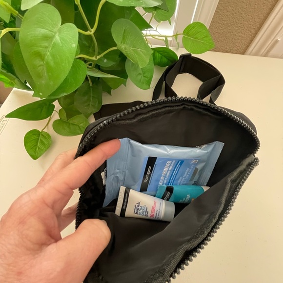 Neutrogena Belt Bag, 1-Lrg Zip Pocket , 1-Smaller Zip Pocket with products. - Picture 6 of 9